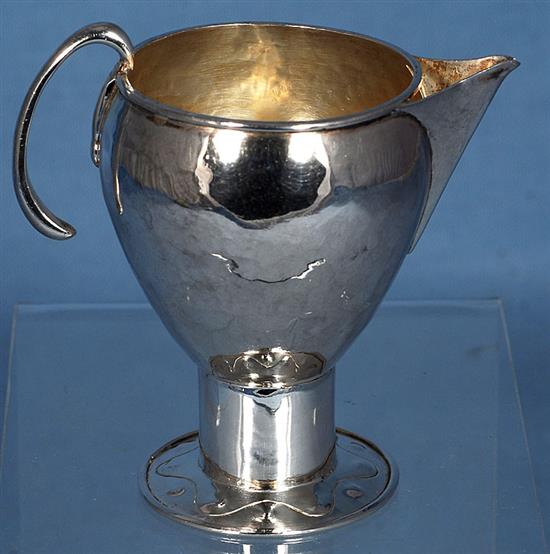 An Edwardian Arts & Crafts silver sparrow beak cream jug, Height 3 ¾”/90mm Weight 2.8oz/80grms